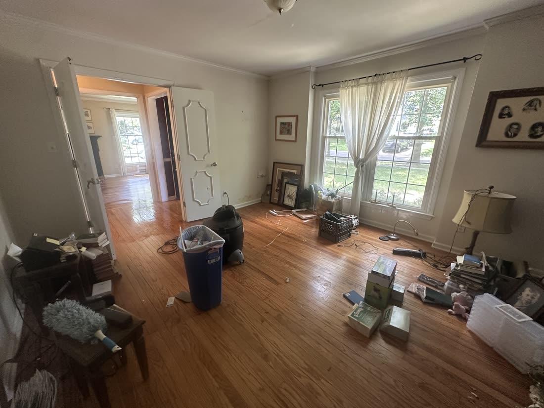 Living room — cleared for move-out — before cleaning
