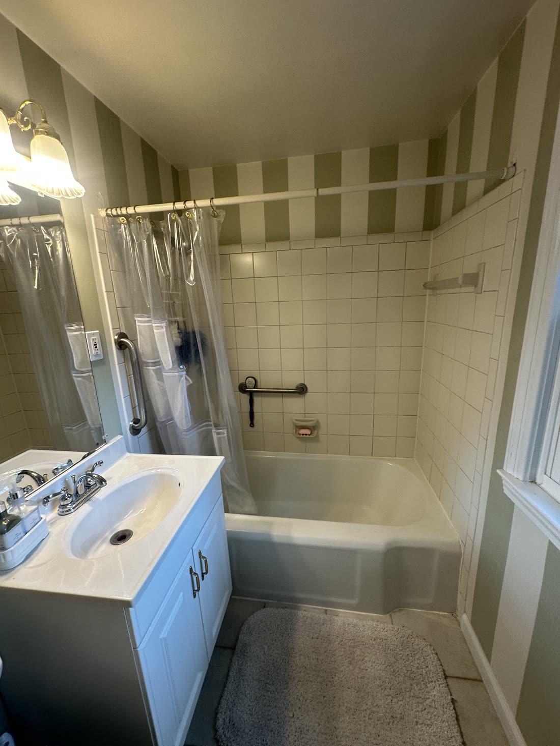 Bathroom with green striped walls